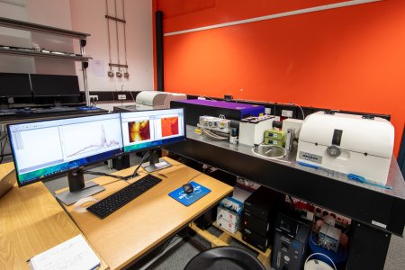 Computer monitors and optical table with NanoIR3s on it